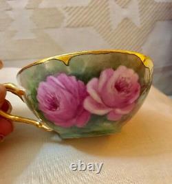 Delightful Limoges twin handle handpainted roses cup and saucer set