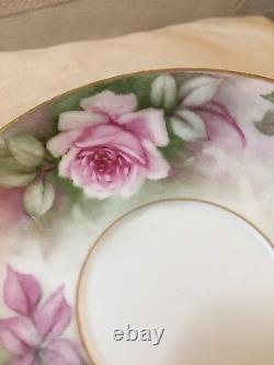 Delightful Limoges twin handle handpainted roses cup and saucer set