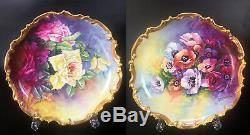 Pair of 12.6'' Limoges France hand-painted chargers, golden border, 1909-1938