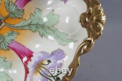 Bol en porcelaine de Limoges peint à la main signé André, de style Art Nouveau, orné de fleurs roses et violettes et de dorures.