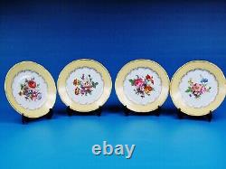 Ensemble de quatre (4) assiettes décoratives peintes à la main Limoges France avec motifs floraux et dorés