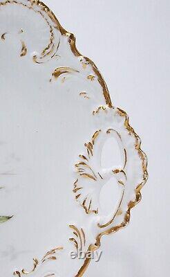 Plateau ou plat en porcelaine AL Limoges France peint à la main, avec motifs floraux et bordure dorée.